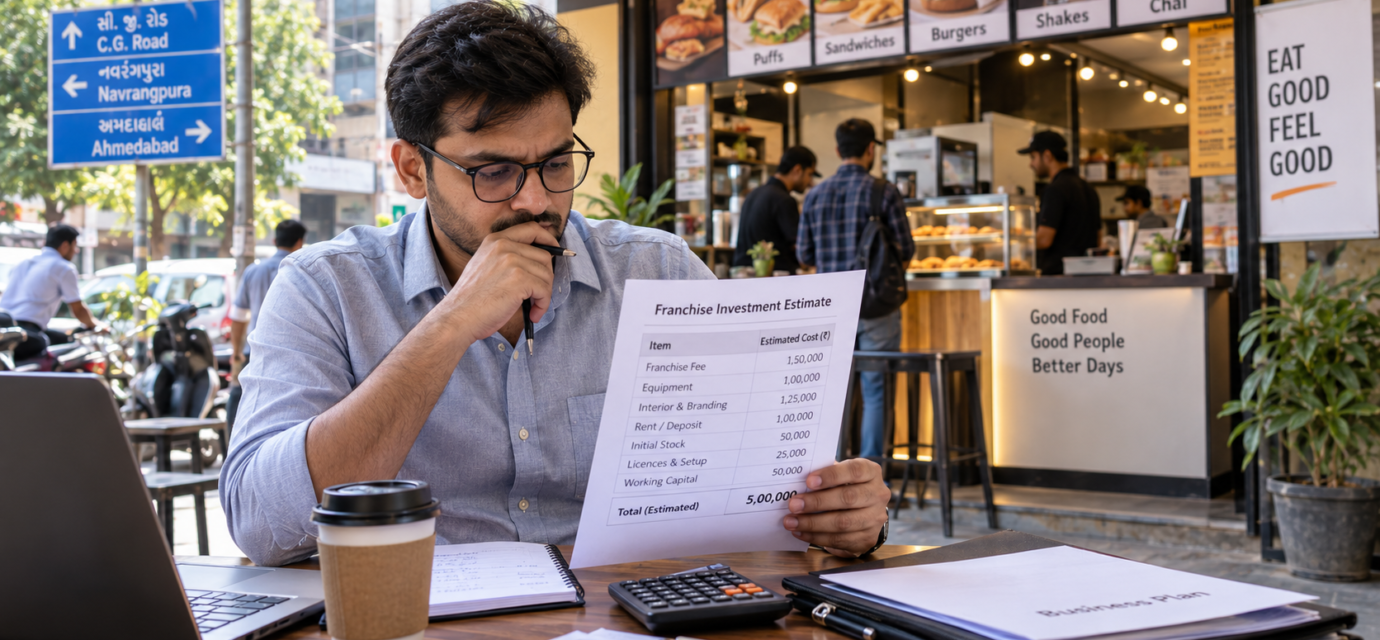 Small-format food franchise outlet in Ahmedabad with an investor reviewing setup costs